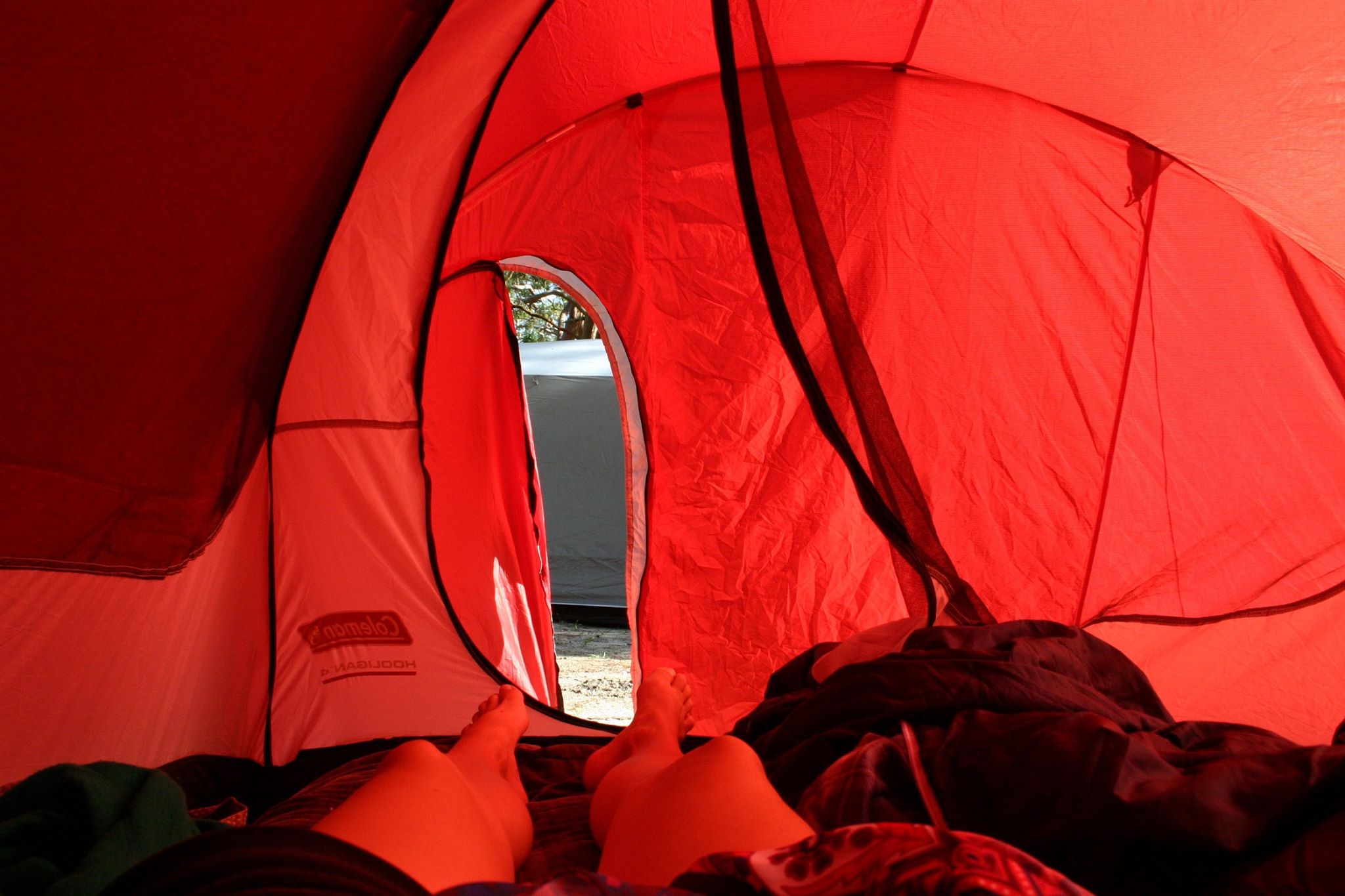 camping in a red tent