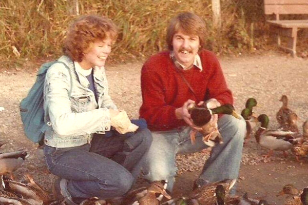 parents feeding ducks